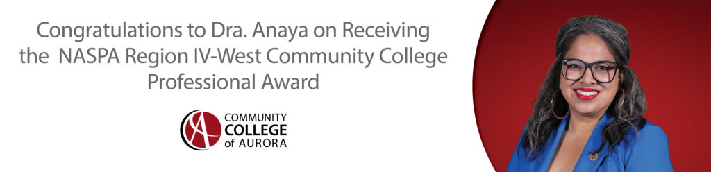 Portrait of a smiling woman with long dark and gray hair, wearing large black glasses, gold hoop earrings, and a royal blue blazer against a red background. Text below reads, “Congratulations to Dra. Anaya on Receiving the NASPA Region IV-West Community College Professional Award,” with the Community College of Aurora logo underneath.