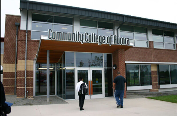 Photo of a brick building with a sign reading 