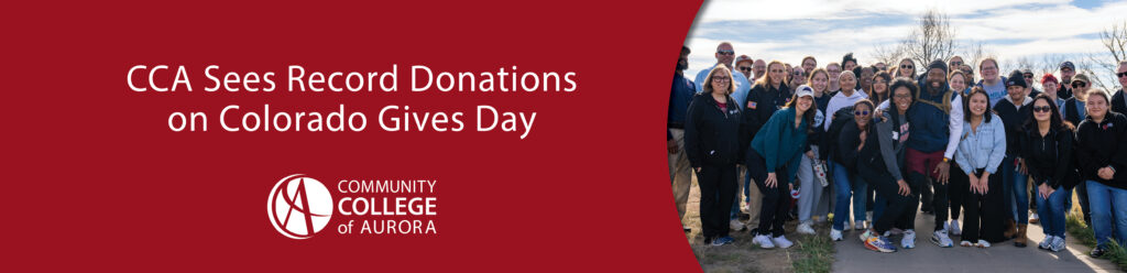 A large group of Community College of Aurora students, staff, and supporters smile and pose together outdoors on a sunny day. The lower half of the image features a red background with white text that reads ‘CCA Sees Record Donations on Colorado Gives Day,’ along with the Community College of Aurora logo.