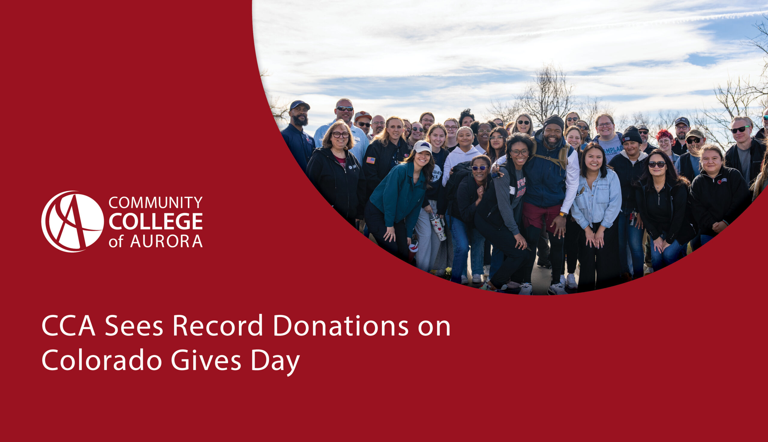 A large group of Community College of Aurora students, staff, and supporters smile and pose together outdoors on a sunny day. The lower half of the image features a red background with white text that reads ‘CCA Sees Record Donations on Colorado Gives Day,’ along with the Community College of Aurora logo.