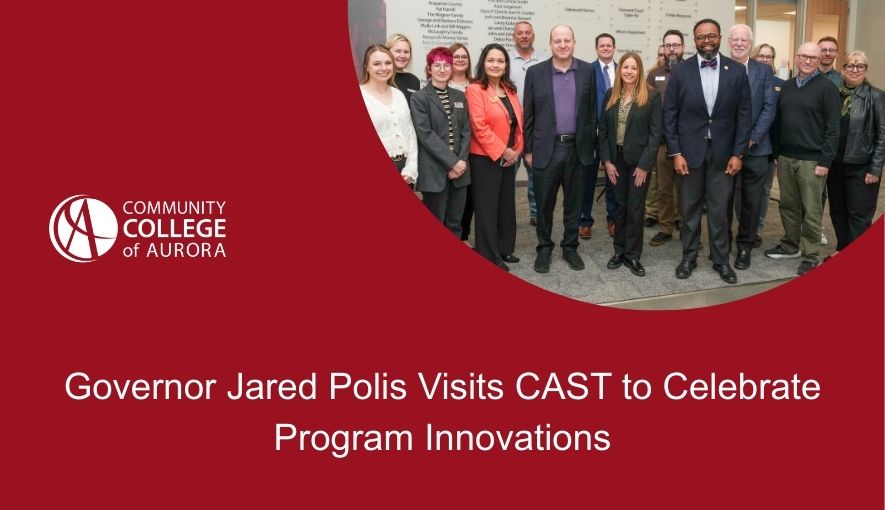 Banner from Community College of Aurora featuring a group photo of Governor Jared Polis standing with college staff and leaders during a visit at the college, with the headline 'Governor Jared Polis Visits CAST to Celebrate Program Innovations' on a red background.
