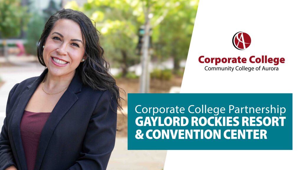 Smiling businesswoman outdoors beside a banner with text that announces Corporate College Partnership: Gaylord Rockies Resort and Convention Center, with the Community College of Aurora logo.